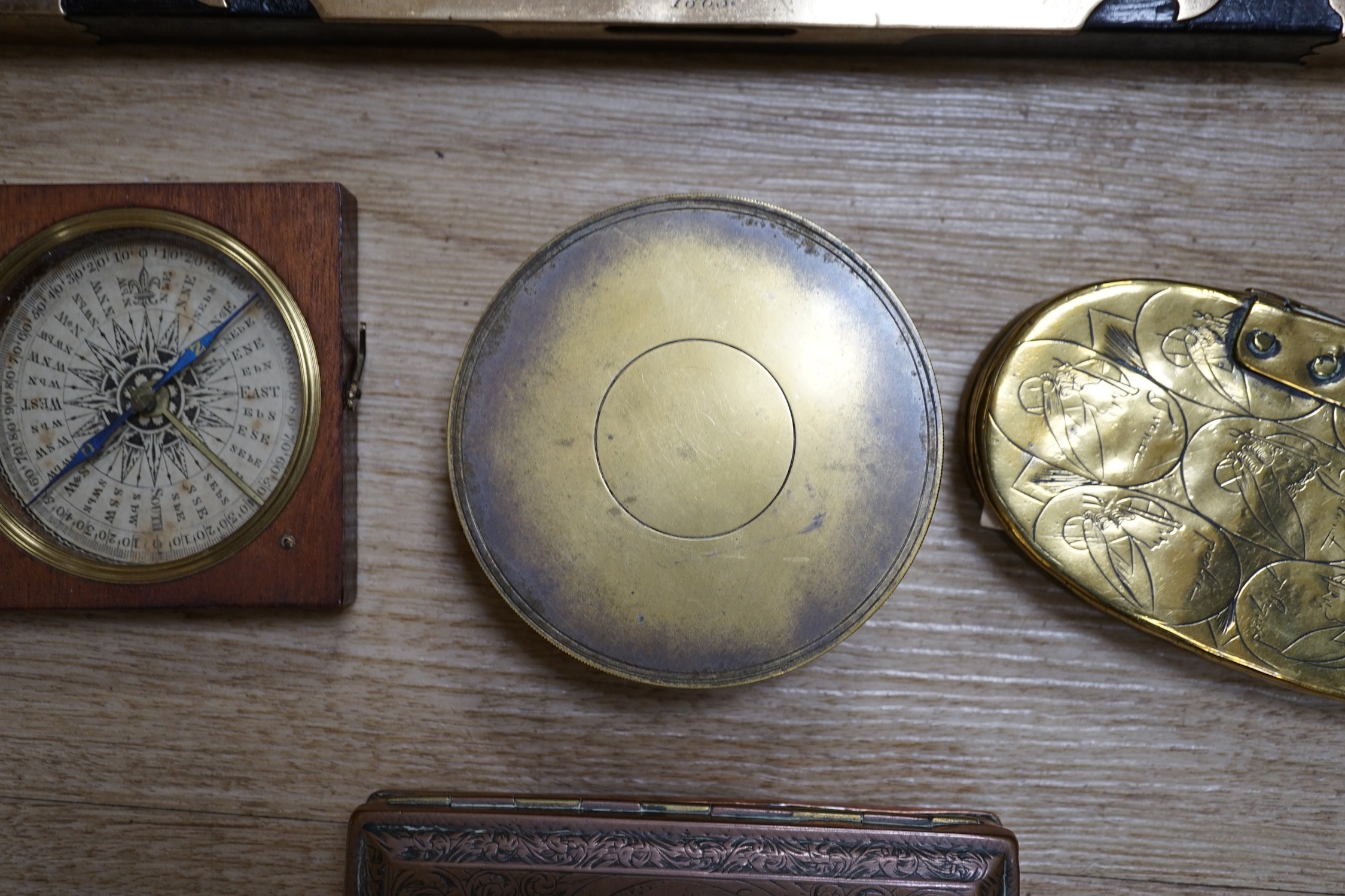 Two portable sundials, two brass inlaid spirit levels and a wood compass, wooden compass 34cm long. Condition - fair to good